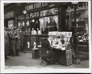 Blind news dealer, Fannie Lyons, at her stand at the south east corner of 7th Avenue & 34th Street