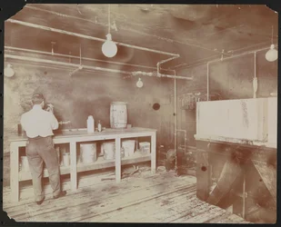Film laboratories at Carlton Motion Picture Co. with five men and one woman working with film, New York