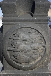 Three Lions Symbol Carved in a Stone Column in the City Hall Square