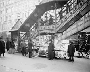 A characteristic sidewalk newsstand in New York City, c.1903