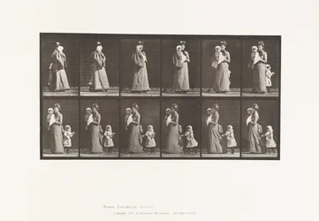 Walking carrying child, turning around; another child holding on to dress
