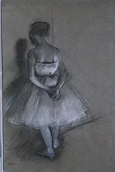 Dancer Standing with Hands Crossed Behind Her Back
