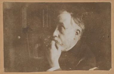 [Self-Portrait in Library (Hand to Chin)]