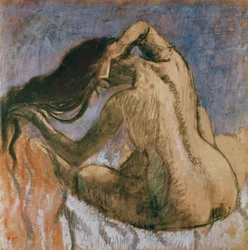 Woman combing her hair, 1905-10