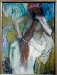 Woman Styling Her Hair