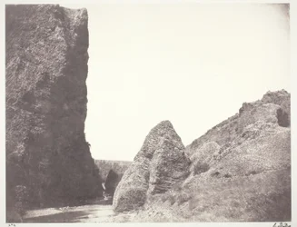Stream Flowing Between a Cliff and Rocks