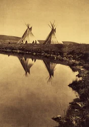 At the water edge: camp piegan at the edge of a water body