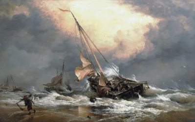 Fishermen pulling their boats on the shore of the North Sea, near Scheveningen