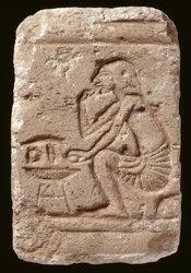 Relief of a man seated beside a table, Amarna Period