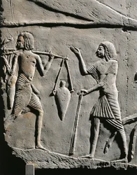 Life in a military camp: water bearer receiving orders from an officer, relief from the tomb of Horemheb at Saqqara (detail)
