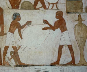 Vasemakers polishing a vase