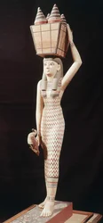 Woman carrying offerings