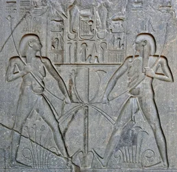 Detail of the base of the statue of Pharaoh Ramses II representing the union of Upper and Lower Egypt. Temple of Luxor, East Bank (Thebes), Egypt