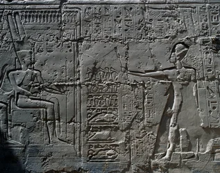 The king before God Amun (detail)