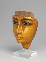 Face from a coffin, with eyes and eyebrows inlaid, gilded