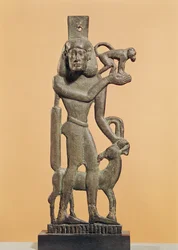Figure of a man holding a monkey with an ibex licking his knee, Saite Period