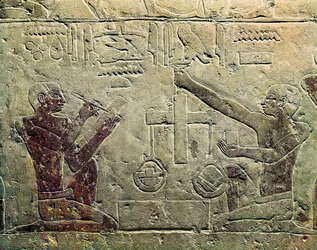 Bas Relief Representing a Merchant and a Customer: One of the Figures Uses a Scale While the Other Takes Notes, c.2465-2323 BC