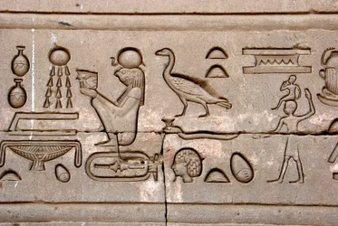 Egyptian antiquity: hieroglyphs on the eastern wall of Hathor Temple, Denderah, Egypt