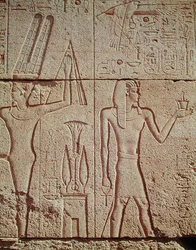 Relief Depicting Philip Arridaeus Holding a Censer Before Amun with the God Min on the Left