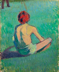 Boy sitting in the grass