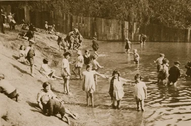 Children playing in Hampstead pond