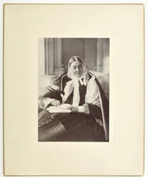 Florence Nightingale, seated on a couch in the Blue Room at Claydon House, 1891