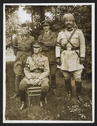 Gen. Sir James Willcocks and his personal staff in the garden at his headquarters [Merville, France]. 31 July 1915