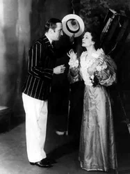 George Curzon as Algernon Moncrieffe (Algy) and Ursula Jeans as Cecily Cardew, in The Importance of Being Earnest, by Oscar Wilde at the Old Vic Theatre, 5 February 1934