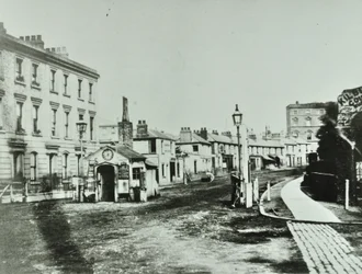 Kilburn Toll Gate at south end of Kilburn High Road by junction of Kilburn Priory, Camden Libraries