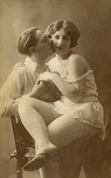 Man Kissing Woman on Cheek