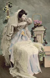 Mother kissing baby