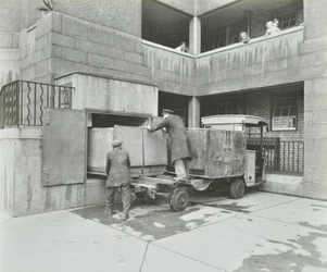 Ossulston Estate: dustmen empty container at the bottom of the rubbish chute