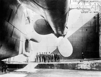 Workmen Standing under One of the Propellers of the Titanic, 31 May, 1911