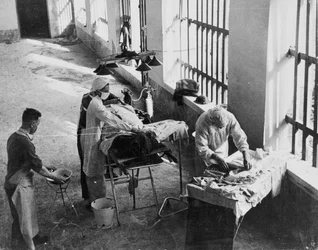 A Field Surgery Unit operating in an Italian prison under fire during World War Two, from a collection of 650 photographs compiled by the Command Association