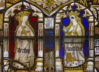 A panel in the east window depicting the Cardinal Virtues: Truth (Veritas) and Justice (Iustitia)