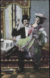 A well-dressed couple laughing