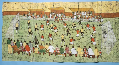 African batik illustrating a football match with crowds watching in the stands