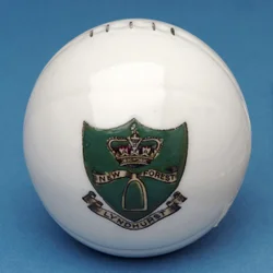Armorial souvenir miniature football with transfer of the Lyndhurst, New Forest crest (ceramic)