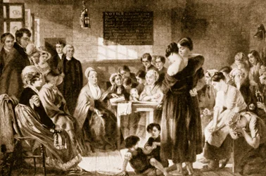 Elizabeth Fry reading the Bible in a prison