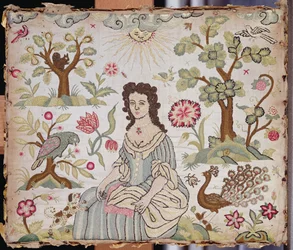 Embroidered panel depicting a lady in a garden, c.1700