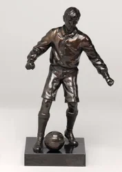 Footballer, part of a clock set