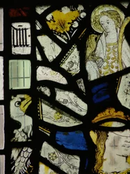 Fragments including a young saint with a bird