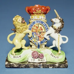 Spill vase, in the form of the Royal Arms on a black marble plinth, Walton
