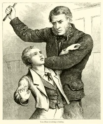 Tom Hunt receiving a Caning