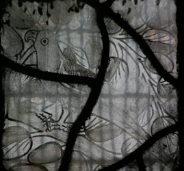 Window NW depicting a bird