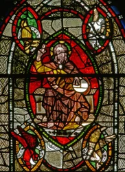 Window depicting Christ in Majesty surrounded by Evangelist symbols