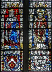 Window depicting figures and shields below