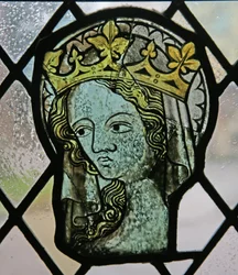 Window in the Cloisters depicting a female head (sainted and crowned)