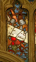 Window depicting the angelic choir with musical score
