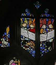 Window depicting the angelic choir singing; angel censing